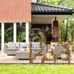 Real photo of a beautiful terrace with garden furniture, plants