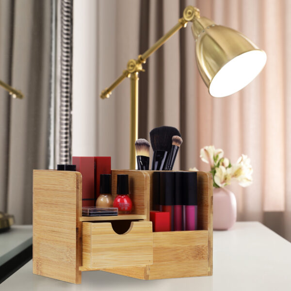 Luxury makeup products and accessories on dressing table with mi