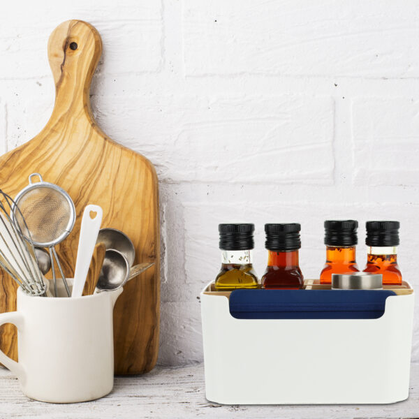 Kitchen tools, olive cutting board on a shelf against white brick wall. selective focus
