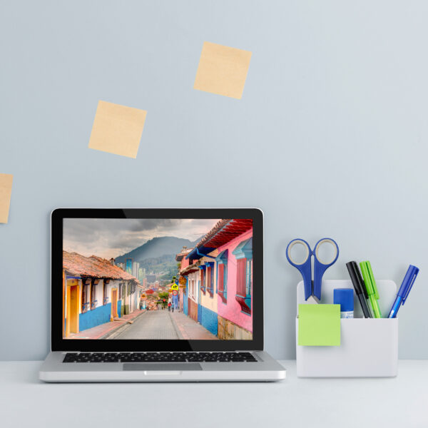 Laptop macbook screen on a bright blue background office workspa