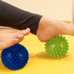 Female feet and prickly massage balls