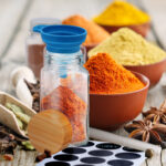 Aromatic spices and herbs: red pepper, turmeric, cardamom, cinna