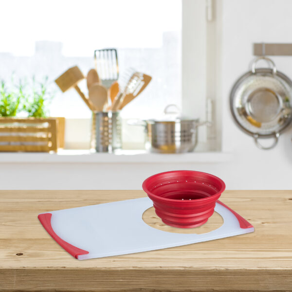 Wooden table top on blurred kitchen interior with copy space