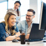 Group of business people and software developers working as a te