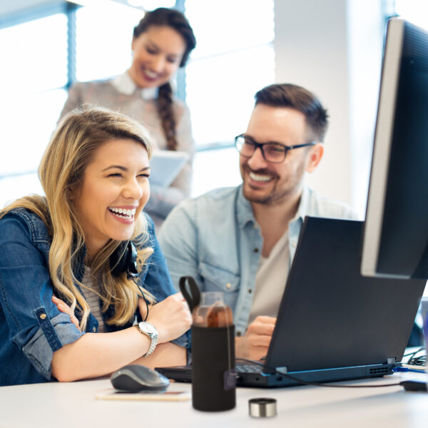 Group of business people and software developers working as a te