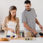 couple cooking food at home kitchen