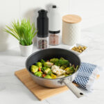 a pan containing an array of colorful healthy vegetables on a mo