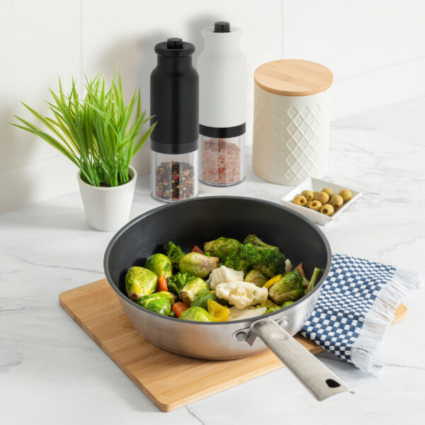 a pan containing an array of colorful healthy vegetables on a mo